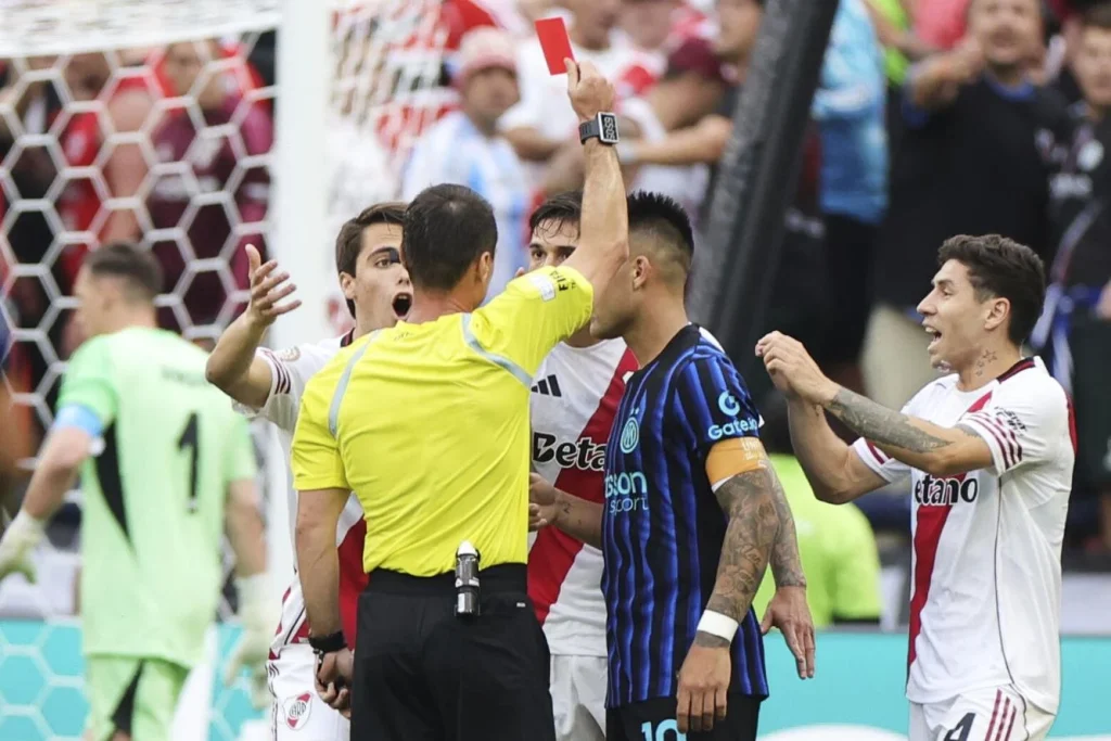 Referee lgiz Tantashev shows a red card to River Plate's Lucas Martinez Quarta