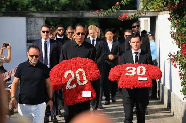 Liverpool’s Virgil Van Dijk and Andy Robertson arrive at the funeral of Diogo Jota (Picture: EPA)