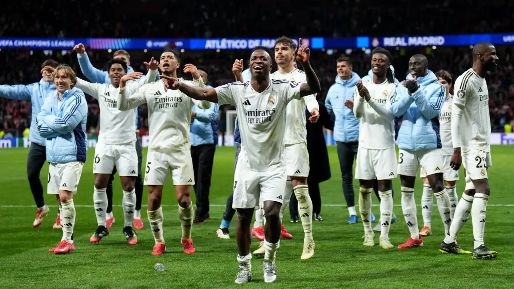 Vinicius Junior celebrates victory with teammates after Real Madrid defeat Atletico de Madrid (Photo Credit: Getty)