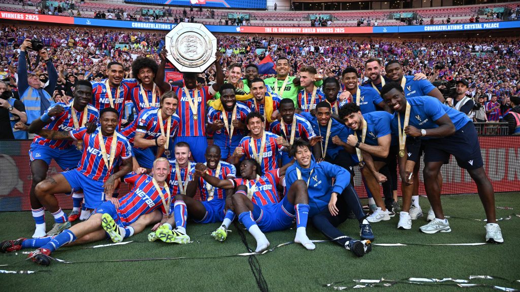 Crystal Palace Captain, Marc Guehi lifting the Community Shield while his teammates pose for a picture. Photo credit: Crystal Palace media.