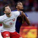 Polish superstar Robert Lewandowski duels with Jurriën Timber. (Photo Credit: Netherlands Football Media)