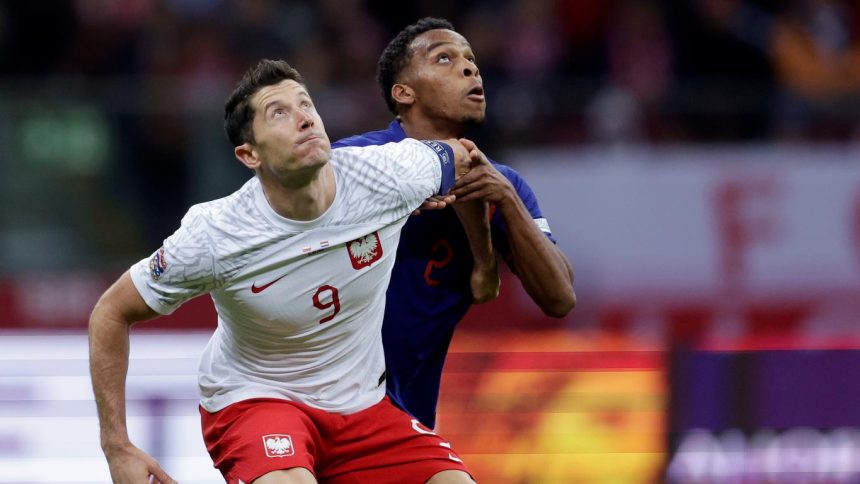 Polish superstar Robert Lewandowski duels with Jurriën Timber. (Photo Credit: Netherlands Football Media)