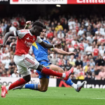 Saka against a Leeds player during Arsenal 5-0 victory over Leeds in August. (Credit: Arsenal media)