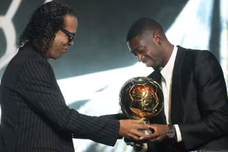 Ballon d'Or 2025 winner Ousmane Dembele receives the trophy from Ronaldinho (Credit: Ballon d’Or via X)
