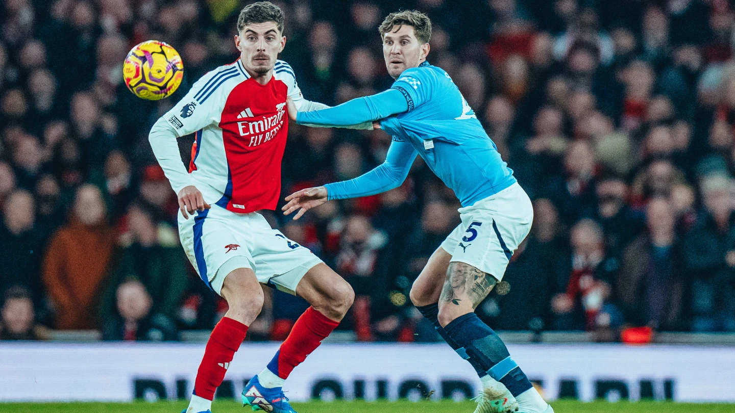 Stones contending with Arsenal player Kai Havertz during City's 5-1 defeat at the Emirate last season. (Credit: Manchester City website).