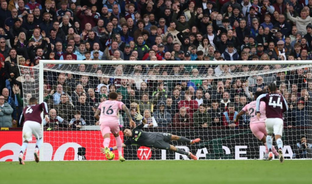 Emi Martinez saves a penalty. (Photo credit: Premier League Media).