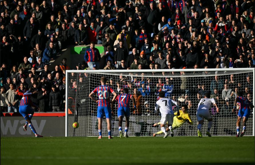 Jean-Philippe Mateta scores penalty against Senne Lammens. (Photo Credit: Premier League Media).