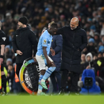 Jeremy Doku and Pep Guardiola (Photo Credit: Manchester City website)