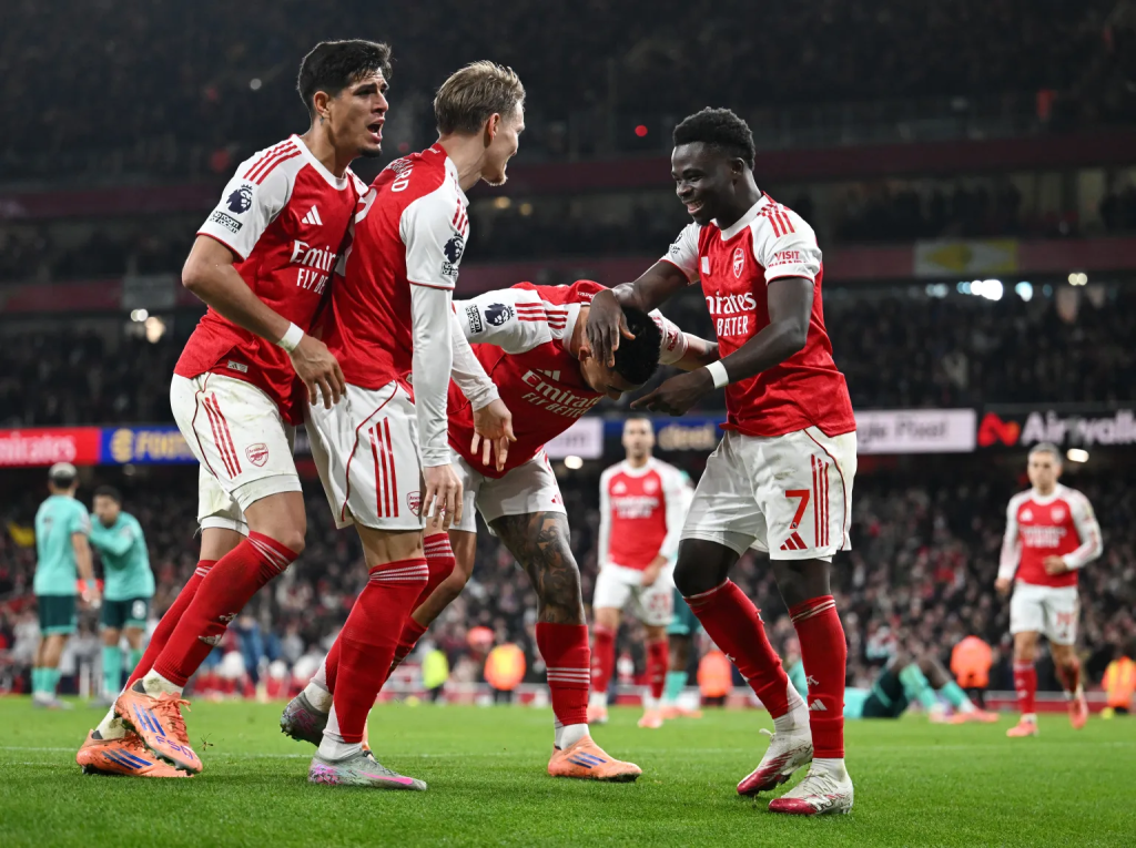 Arsenal players celebrate after scoring the winner (Photo Credit: Arsenal Media)