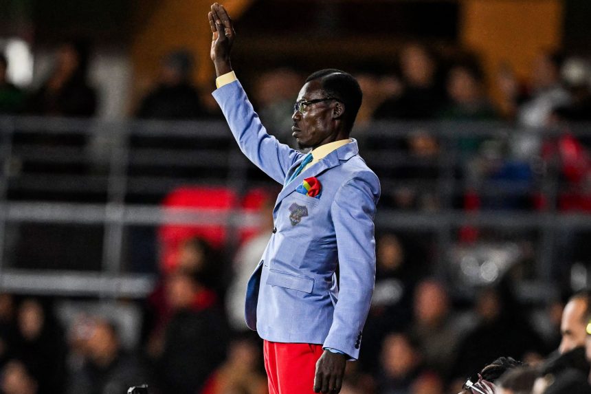 Michel Kuka Mboladinga posing as Lumumba (Photo Credit: DR Congo football Media)