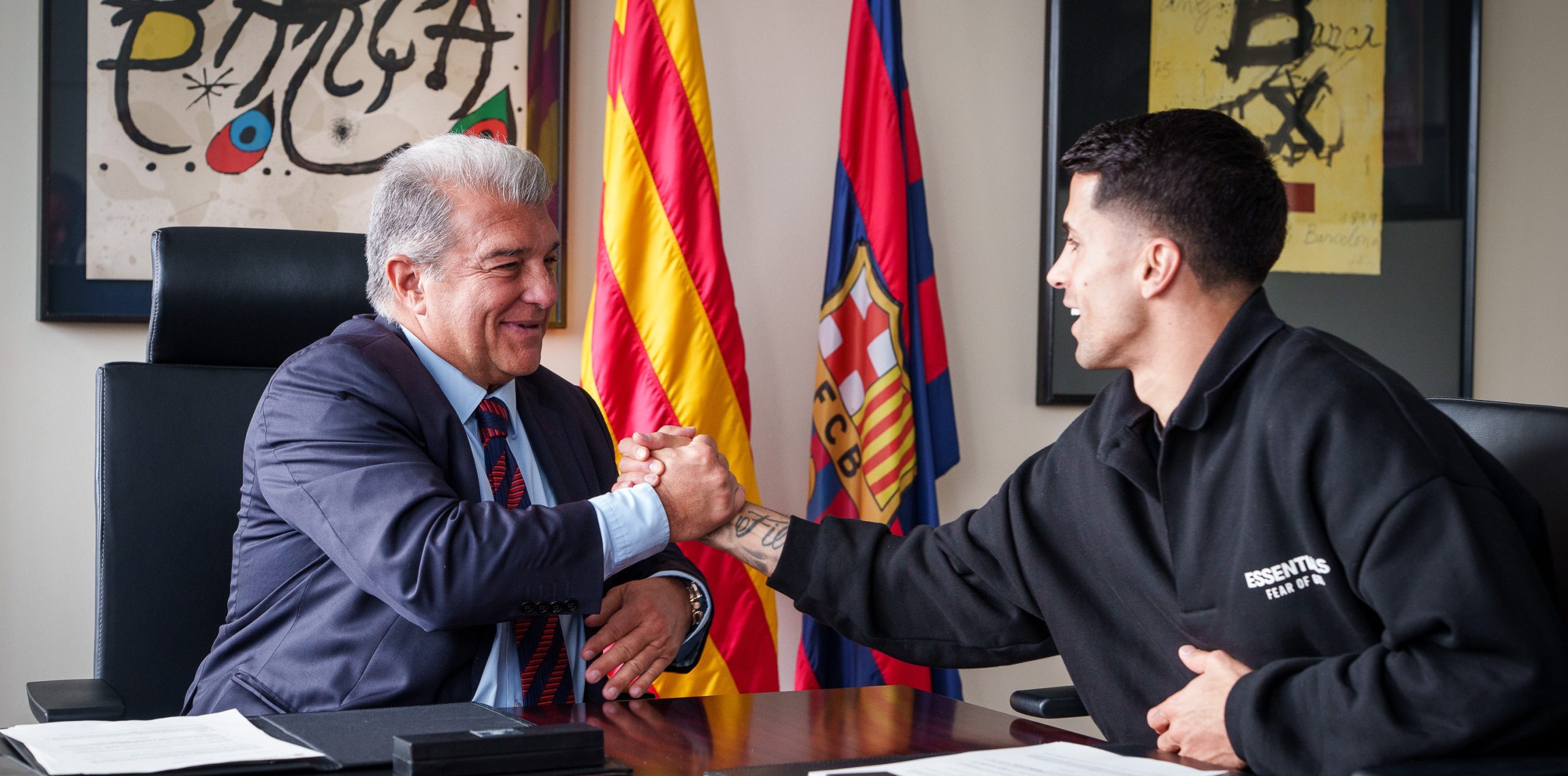 João Cancelo and Joan Laporta (Photo Credit: Barcelona via X)