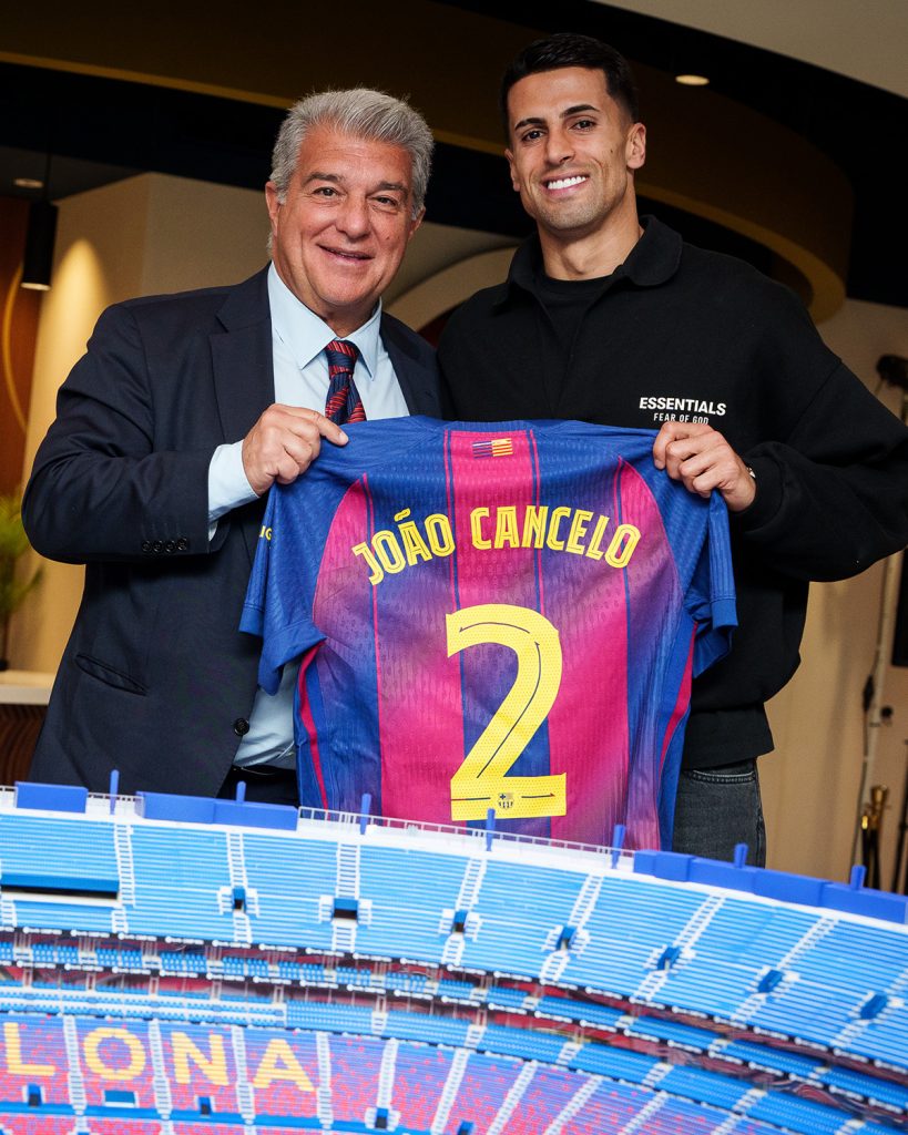 João Cancelo and Joan Laporta (Photo Credit: Barcelona via X)