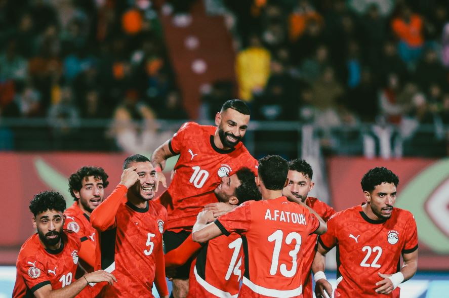 Omar Marmoush and Mohamed Salah celebrate with Egypt teammates. (Photo Credit: CAF Media).