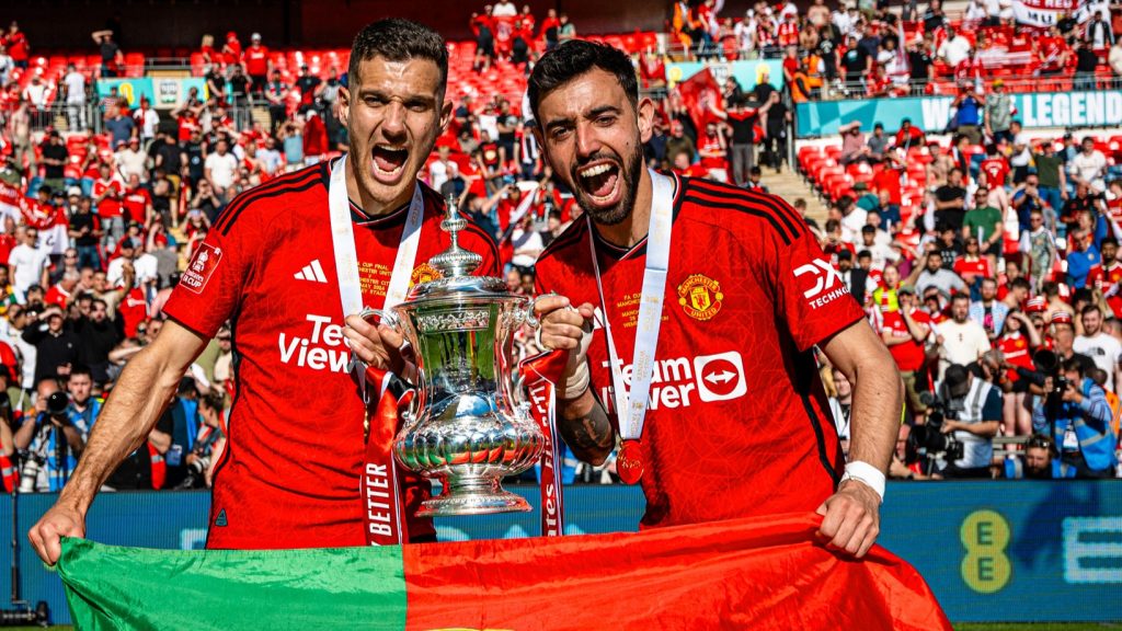 Diogo Dalot and Bruno Fernandes. (Photo Credit: Manchester United Media).