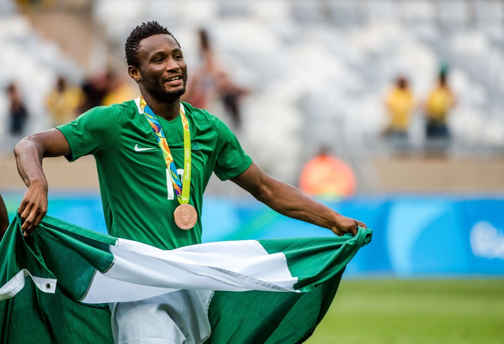 Nigeria's John Obi Mikel celebrates after receiving the bronze medal during the medal ceremony after defeating Honduras in the Rio 2016 Olympic Games men's bronze medal football match at the Mineirao stadium in Belo Horizonte, Brazil, on August 20, 2016.  / AFP / GUSTAVO ANDRADE        (Photo credit should read GUSTAVO ANDRADE/AFP/Getty Images)