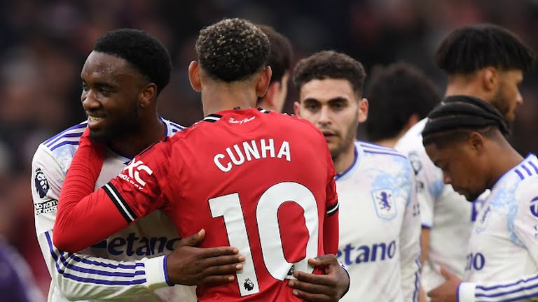 Manchester United's Matheus Cunha and Aston Villa's Lamare Bogarde embrace after the match - Photo Credit : Reuters