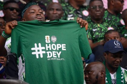 Nigerian Fan with Tshirt branded Hope Day we must Qualify ahead of 2026 world Cup - Photo credit : BBC