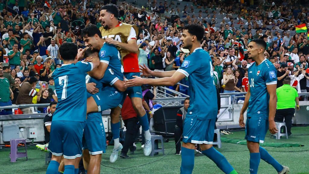 Iraq national team players celebrating (photo credit: Reuters)