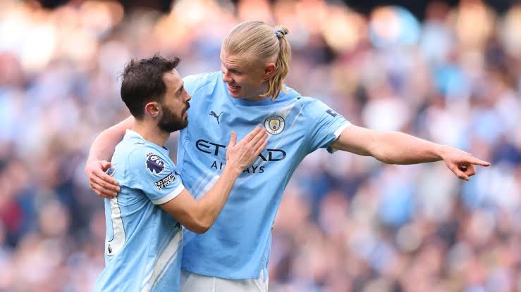 Haaland with Bernardo Silva (photo credit: ESPN)