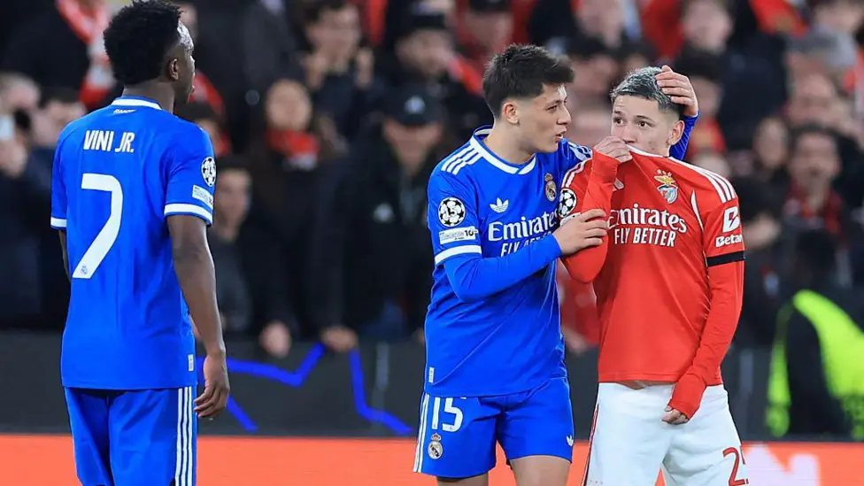 Gianluca Prestianni (red shirt) denied directing racist abuse towards Vinicius - Photo credit: bbc media