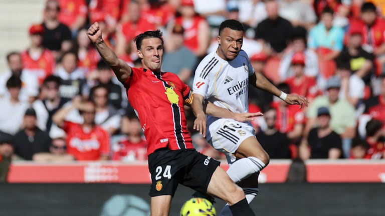 Real Madrid's Kylian Mbappe in action with RCD Mallorca's Martin Valjent - Photo Credit : Reuters