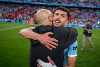 Pep Guardiola hugging Matheus Nunes (Photo credit: Man city media)