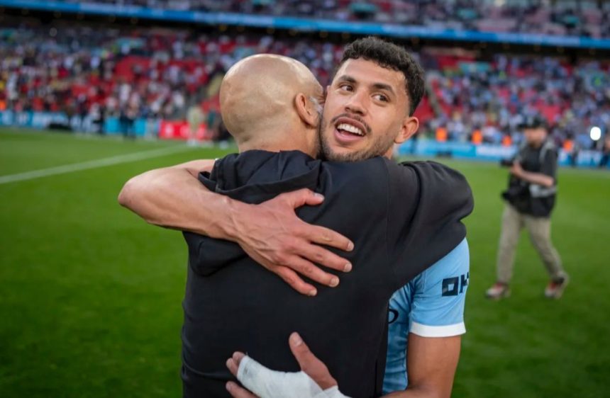 Pep Guardiola hugging Matheus Nunes (Photo credit: Man city media)