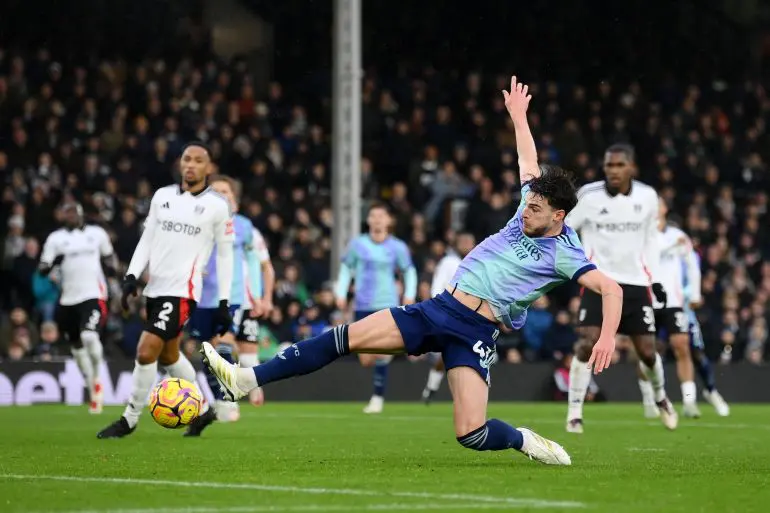 Declan rice stretches to reach the ball (Photo credit: hayters media)