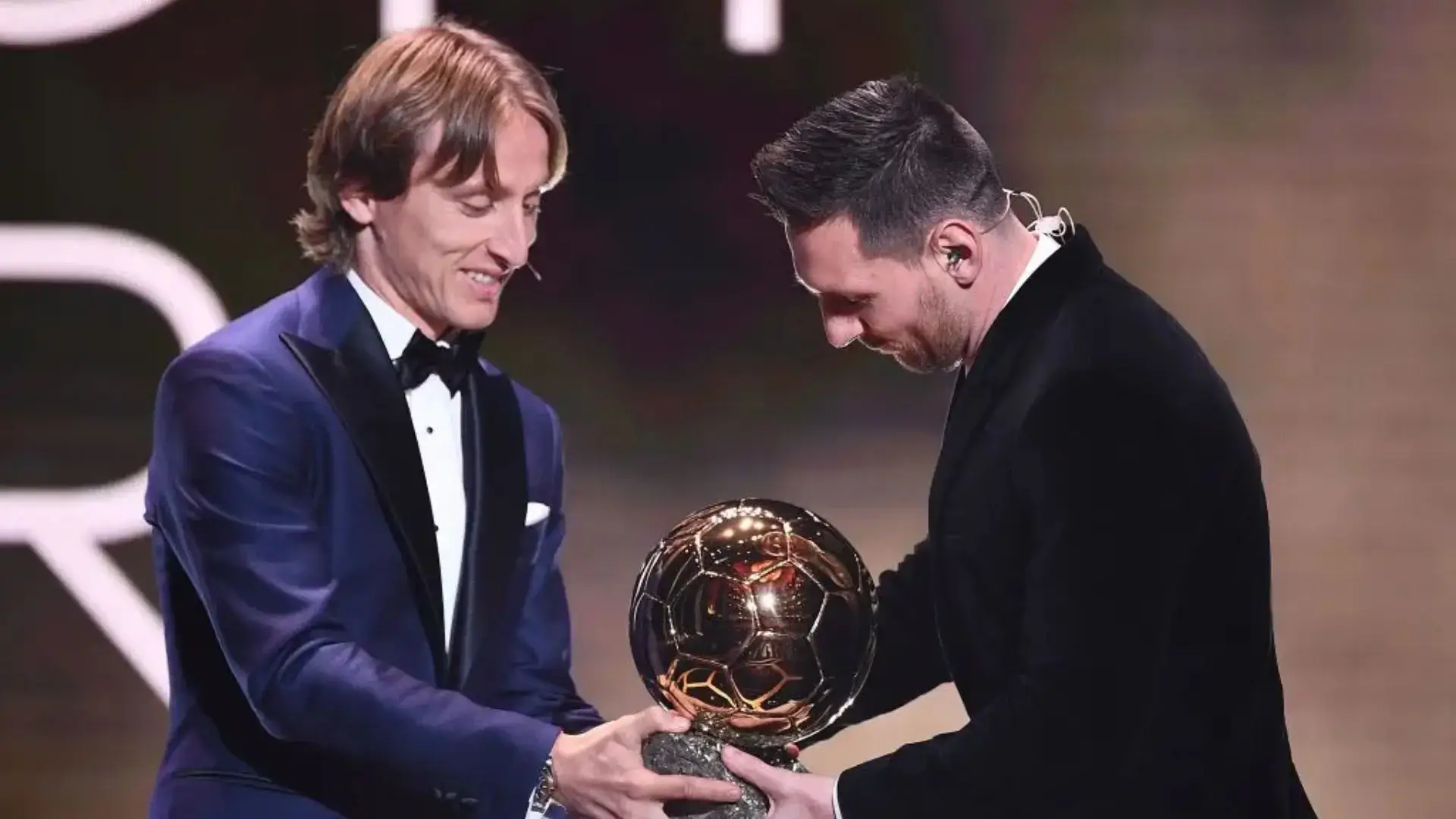 modric and messi. (photo credit: yahoo sport)