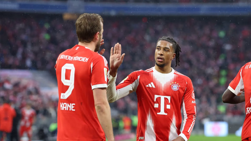 harry kane and olise. (photo credit: bundesliga media)