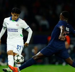 Paris St Germain's Nuno Mendes in action with PSV Eindhoven's Richard Ledezma - Photo Credit : REUTERS